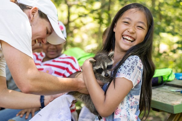 Camper with baby raccoon